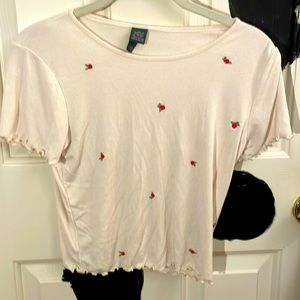 White T-shirt with roses on it
